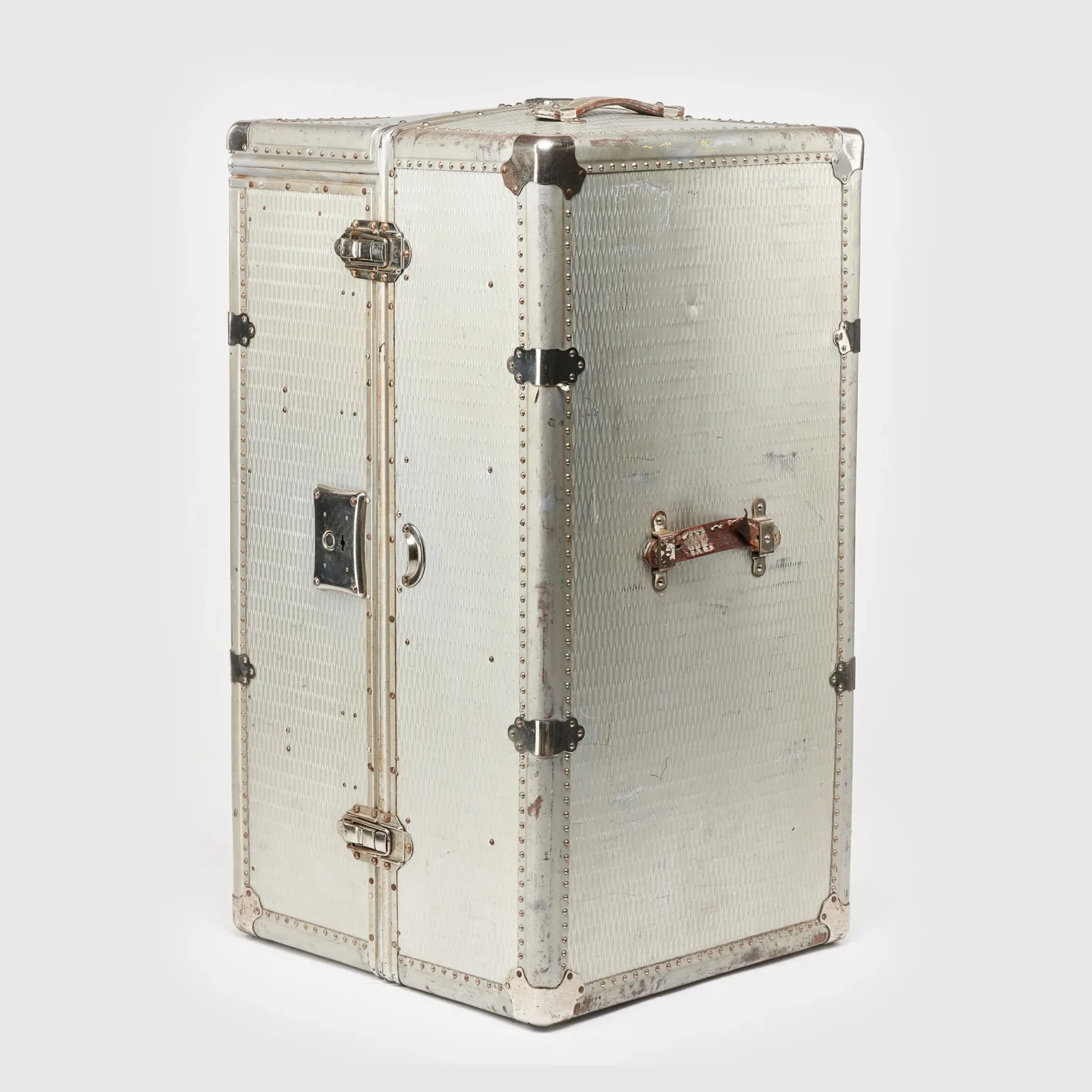 A silver Rimowa Heritage Wardrobe Trunk against a white background.