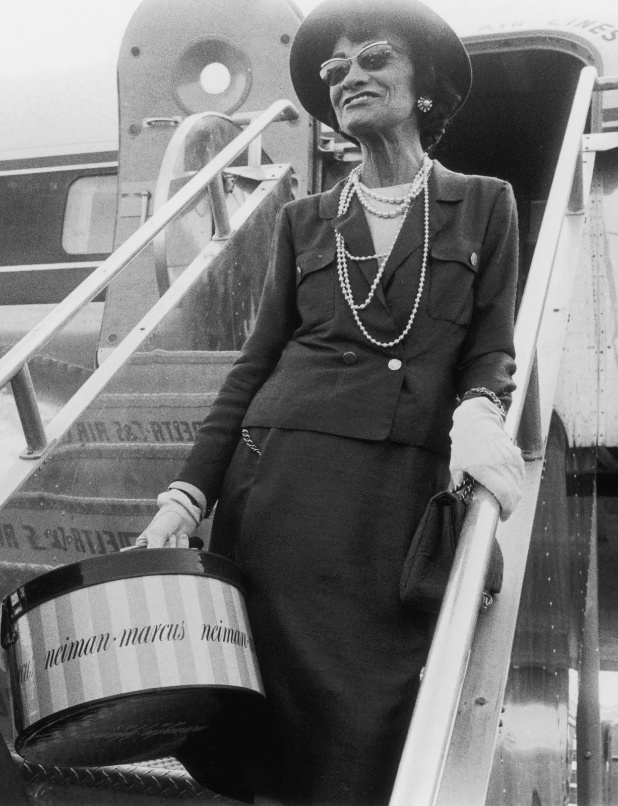 Image may contain Human Person Coco Chanel Clothing Sleeve Apparel Sunglasses Accessories Accessory and Long Sleeve